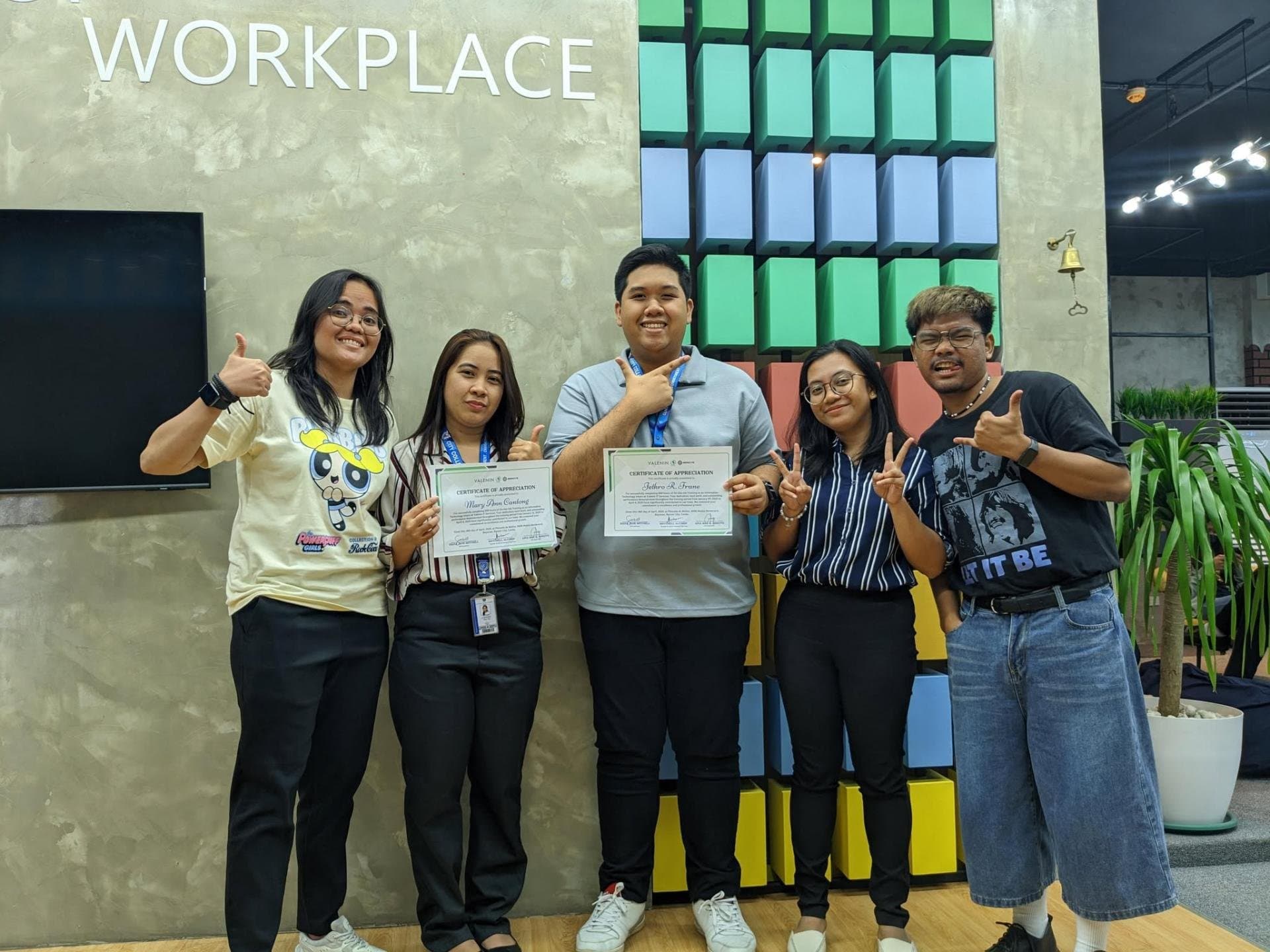 Jethro Frane at the internship certificate presentation with fellow interns and colleagues